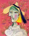 Woman in straw hat on flowery background 1938 cubist Pablo Picasso
